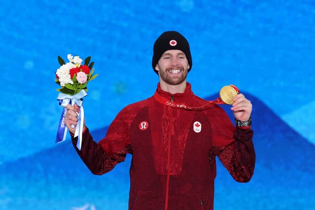 Gold medalist Max Parrot of Team Canada poses with their medal during the Men's Snowboarding Slopestyle Medal Ceremony at Medal Plaza on February 07, 2022 in Zhangjiakou, China