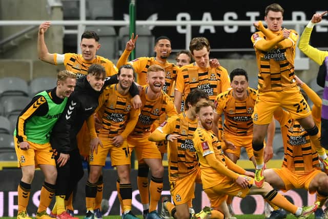 Cambridge players celebrate after their 1-0 victory after the Emirates FA Cup Third Round match between Newcastle United and Cambridge United at St James' Park 