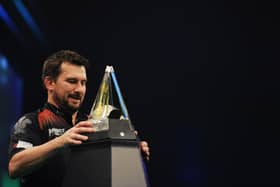 Jonny Clayton of Wales collects the trophy after winning his Final match against Jose de Sousa of Portugal during Night 17 of the Unibet Premier League Darts at Marshall Arena on May 28, 2021 in Milton Keynes, England