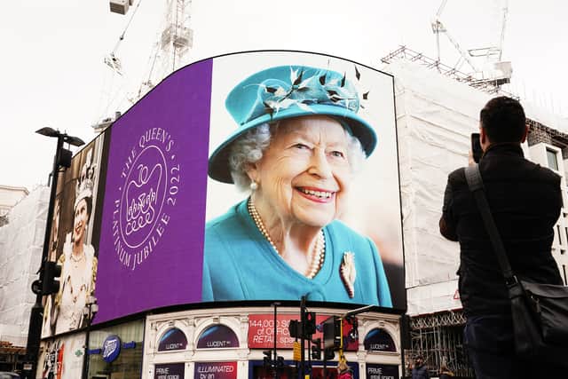Images of Queen Elizabeth II displayed on the lights in London’s Piccadilly Circus to mark her Platinum Jubilee (image: PA)