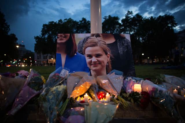 Flowers surround a picture of Jo Cox during a vigil in Parliament Square on June 16, 2016 in London (Photo by Dan Kitwood/Getty Images)