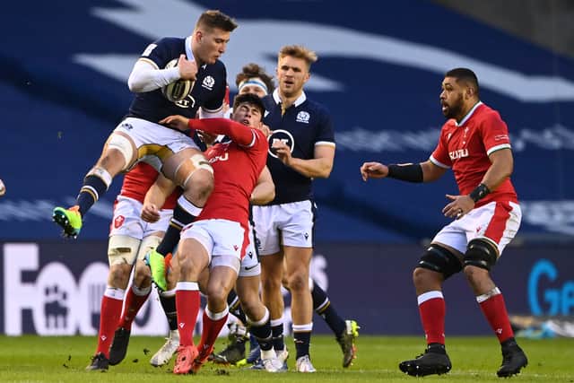 Matt Fagerson of Scotland takes a high ball under pressure from Louis Rees-Zammit of Wales  during the Guinness Six Nations match between Scotland and Wales at Murrayfield on February 13, 2021 in Edinburgh