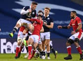 Matt Fagerson of Scotland takes a high ball under pressure from Louis Rees-Zammit of Wales  during the Guinness Six Nations match between Scotland and Wales at Murrayfield on February 13, 2021 in Edinburgh