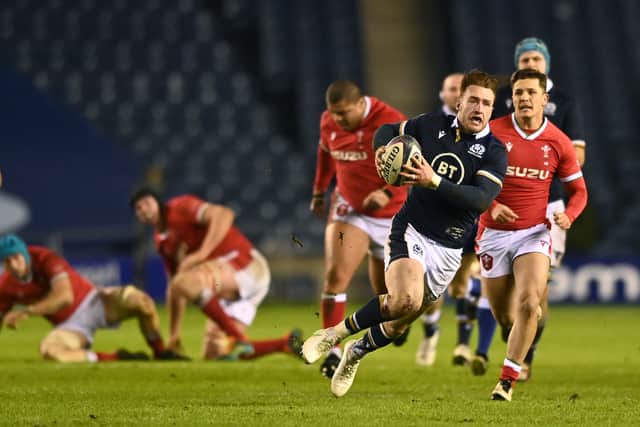 Scotland player Stuart Hogg slips as he makes a break towards the Wales line during the Guinness Six Nations match between Scotland and Wales at Murrayfield on February 13, 2021 in Edinburgh