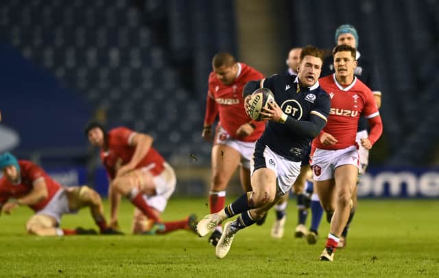 Scotland player Stuart Hogg slips as he makes a break towards the Wales line during the Guinness Six Nations match between Scotland and Wales at Murrayfield on February 13, 2021 in Edinburgh