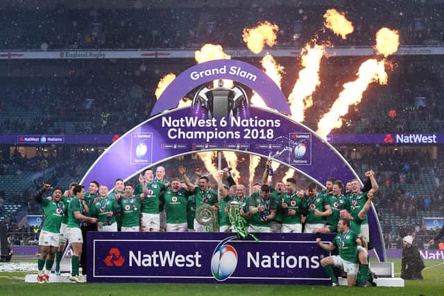 The Ireland team celebrate with the NatWest Six Nations trophy and the Grand Slam after the NatWest Six Nations match between England and Ireland at Twickenham Stadium on March 17, 2018 in London, England