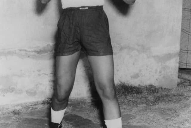 Nelson Mandela, leader of the African National Congress (ANC), adopts a boxing pose, wearing shorts, t-shirt and boxing gloves, circa 1950 (Photo: Keystone/Hulton Archive/Getty Images)