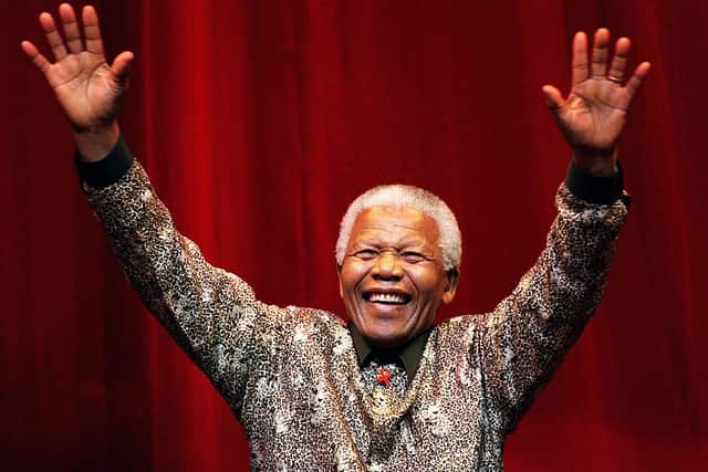 Nelson Mandela waves to the crowd after speaking at the Colonial Stadium for the World Reconciliation Day Concert September 8, 2000 in Melbourne, Australia (Photo: Hamish Blair/Liaison)