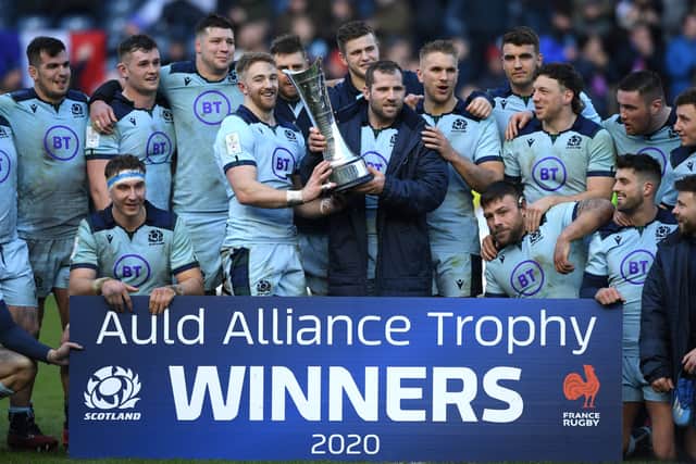 yle Steyn and Fraser Brown of Scotland lift the Auld Alliance Trophy following their victory after the 2020 Guinness Six Nations match between Scotland and France at Murrayfield on March 08, 2020 in Edinburgh, Scotland