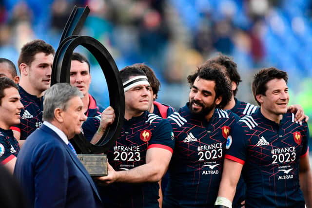 France's hooker and captain (C) Guilhem Guirado and teammates pose with the Garibaldi trophy after winning 18-40 the International Six Nations rugby union match Italy vs France on March 11, 2017 at the Olympic Stadium in Rome