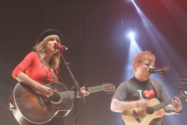 Taylor Swift joins Ed Sheeran on stage at his sold-out show at Madison Square Garden Arena on November 1, 2013 in New York City (Photo: Anna Webber/Getty Images for Atlantic Records)