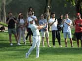 Rory McIlroy of Northern Ireland hits his second shot on the 16th hole during day four of the Slync.io Dubai Desert Classic at Emirates Golf Club on January 30, 2022 in Dubai, United Arab Emirates