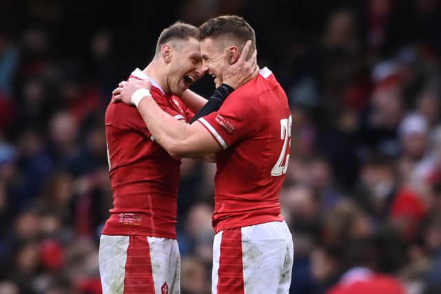 Wales players Dan Biggar (l) and Jonathan Davies celebrates at the end of the game, both players were making their 100th appearance during the Guinness Six Nations match between Wales and Scotland at Principality Stadium on February 12, 2022 in Cardiff