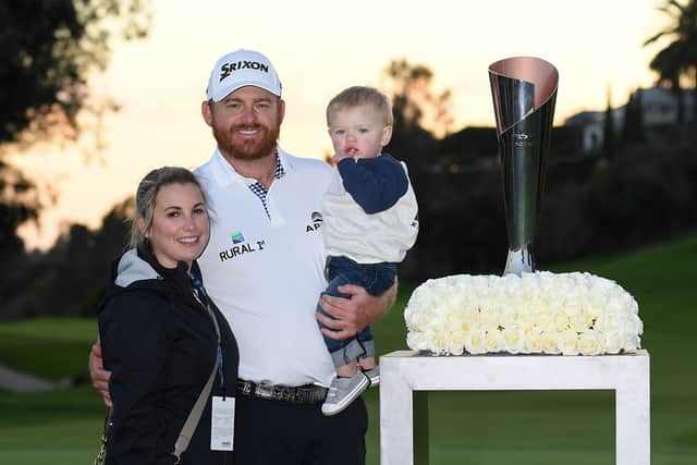 Erica Holmes, J.B. Holmes and Tucker Holmes pose with the trophy after J.B. Holmes wins the Genesis Open at Riviera Country Club on February 17, 2019 in Pacific Palisades, California