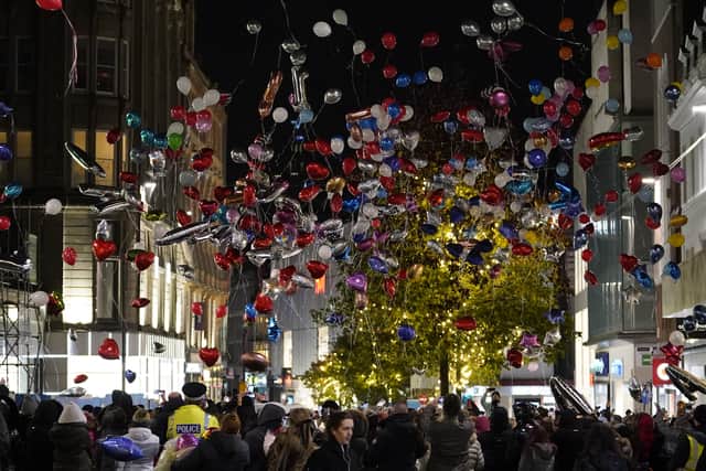 Balloons are released as people take part in a vigil in Liverpool city centre for 12-year-old Ava White.