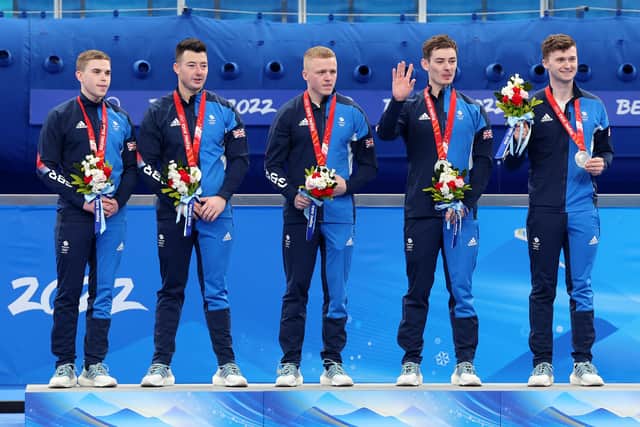 (L-R) Silver medallists Ross Whyte, Hammy McMillan, Bobby Lammie, Grant Hardie and Bruce Mouat of Team Great Britain pose during the Men's Curling Medal Ceremony on Day 14 of the Beijing 2022 Winter Olympic Games at National Aquatics Centre on February 19, 2022