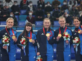 Gold medal winners Milli Smith, Hailey Duff, Jennifer Dodds, Vicky Wright and Eve Muirhead of Team Great Britain stand on the podium with their medals during the medal ceremony after during the Women's Gold Medal match between Team Japan and Team Great Britain at National Aquatics Centre on February 20, 2022 in Beijing, China