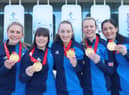 (L-R) Curlers Milli Smith, Hailey Duff, Jennifer Dodds, Vicky Wright and Eve Muirhead of Team Great Britain pose for pictures with their gold medals after winning the  Women's Curling final against Team Japan  at National Aquatics Centre on February 20, 2022 in Beijing, China
