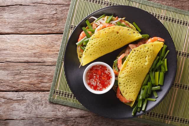 Savoury pancakes from Vietnamese cooking - banh xeo - often have a surf and turf filling (image: Adobe)