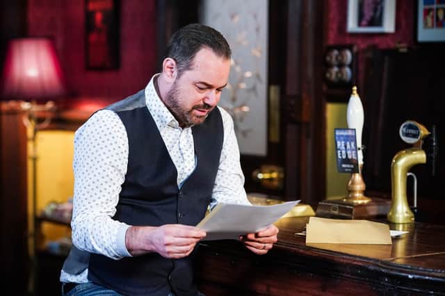 <p>Danny Dyer reading the new TV listings to see when EastEnders is on next (Credit: BBC/Jack Barnes /Kieron McCarron)</p>