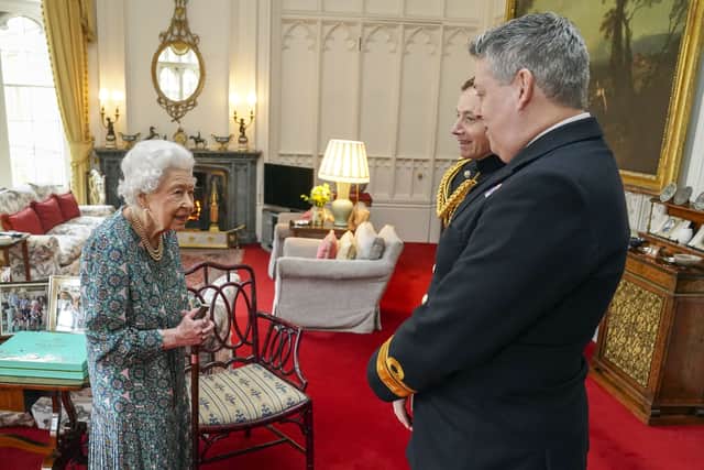 Queen Elizabeth II with Rear Admiral James Macleod and Major General Eldon Millar (right) as she meets the incoming and outgoing Defence Service Secretaries (Photo: PA)