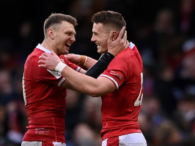 Dan Biggar and Jonathan Davies of Wales celebrate their victory during the Guinness Six Nations match between Wales and Scotland at Principality Stadium on February 12, 2022 in Cardiff, Wales