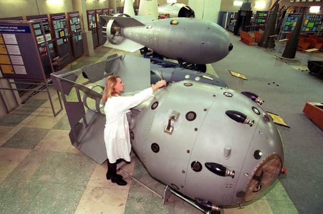A nuclear museum staff member cleans a replica of the first Soviet nuclear bomb tested in 1949 (Photo: ALEXANDER NEMENOV/AFP via Getty Images)