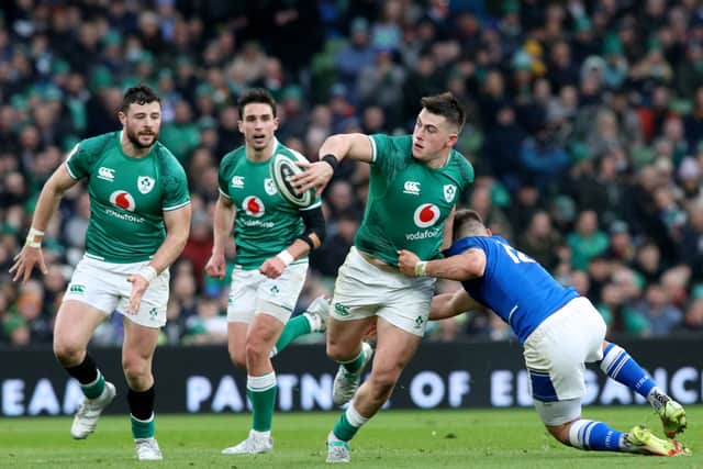 Ireland’s hooker Dan Sheehan offloads as he’s tackled by Italy’s centre Leonardo Marin during the Six Nations international rugby union match between Ireland and Italy