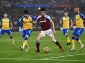 Declan Rice of West Ham United battles for possession with Valentino Livramento and Nathan Redmond of Southampton during the Premier League match between West Ham United  and  Southampton at London Stadium on December 26, 2021 in London, England
