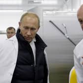 Yevgeny Prigozhin (right) shows Vladimir Putin his school lunch factory outside Saint Petersburg on September 20, 2010 (Photo: Getty)