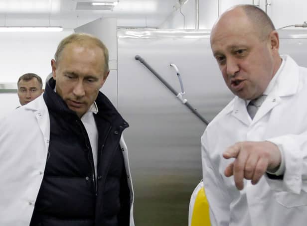 <p>Yevgeny Prigozhin (right) shows Vladimir Putin his school lunch factory outside Saint Petersburg on September 20, 2010 (Photo: Getty)</p>