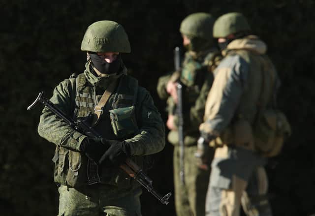 <p>Mercenaries from the Wagner Group are known to mingle with other pro-Russian troops without displaying any identifying insignia (Photo: Getty)</p>