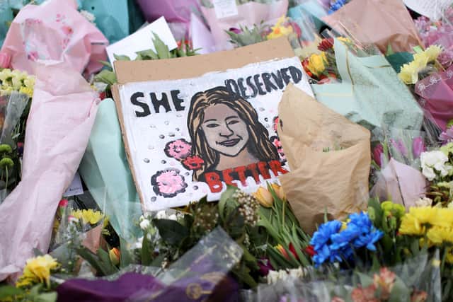 Floral tributes and a poster saying ‘she deserved better’ were placed in tribute to Sarah Everard on Clapham Common after hundreds of people turned out in Clapham Common (image: Getty)