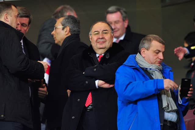Usmanov at an Arsenal game in 2013