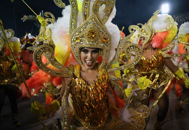 Members of the Salgueiro samba school perform during the last night of Rio’s Carnival parade at the Sambadrome Marques de Sapucai in Rio de Janeiro, Brazil (Photo by CARL DE SOUZA/AFP via Getty Images)