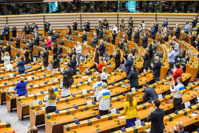 European Parliament members give standing ovation to Volodymyr Zelesnkyy after he addressed the chamber. (Credit: Getty)