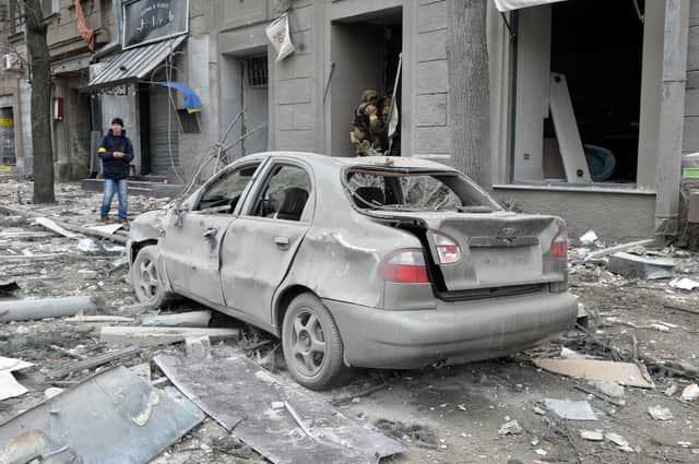 <p>A car in Kharkiv is left destroyed after a Russian troop shelling. (Credit: Getty)</p>