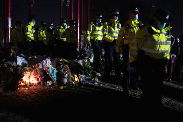 Police officers move from the bandstand area following a series of arrests during a vigil for Sarah Everard on Clapham Common (Photo by Leon Neal/Getty Images)
