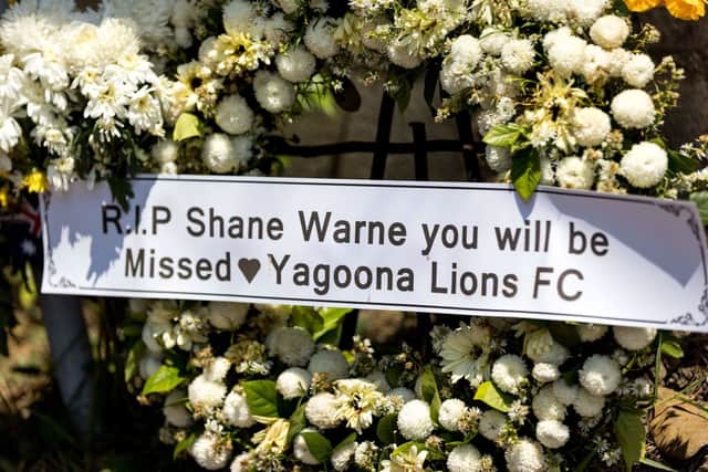 Tributes to Shane Warne have appeared outside the Thai resort he was staying in at the time of his death (image: AFP/Getty Images)