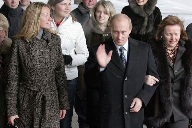 Russian President Vladimir Putin, his former wife Ludmila, and daughter Maria enter a Moscow polling station in 2007 (Photo: ALEXANDER NEMENOV/AFP via Getty Images)