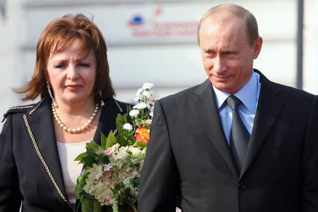 Vladimir Putin and his wife arriving at the airport in 2007  (Photo: Alexander Hassenstein/Getty Images)