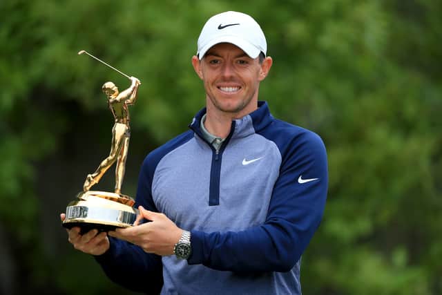  Rory McIlroy of Northern Ireland poses with the trophy after winning The PLAYERS Championship at the TPC Stadium course on March 17, 2019