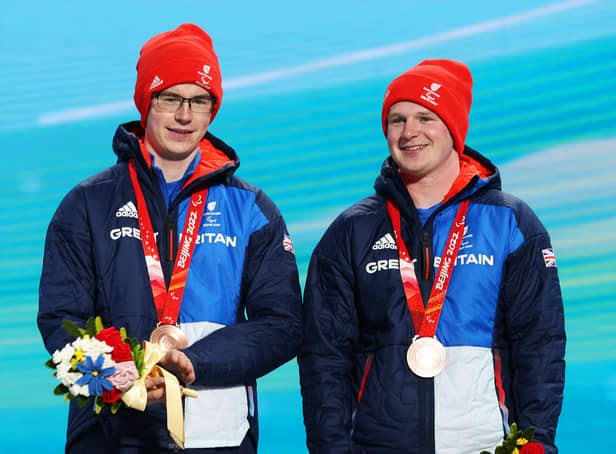 <p>Silver medallist Neil Simpson of Team Great Britain with guide Andrew Simpson. </p>