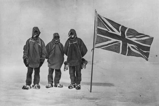 Sir Ernest Henry Shackleton and two members of his expedition team beside a Union Jack within 111 miles of the South Pole, a record feat, circa 1909 (Photo: Hulton Archive/Getty Images)
