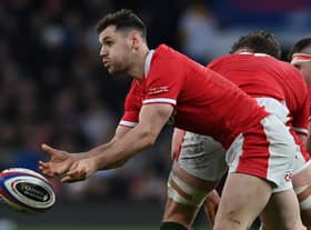 Wales' scrum-half Tomos Williams passes the ball during the Six Nations international rugby union match between England and Wales at Twickenham Stadium, west London, on February 26
