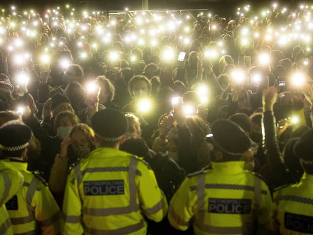 People in the crowd turning on their phone torches in Clapham Common, London, for a vigil for Sarah Everard (PA)