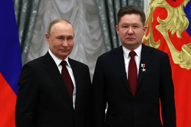 Alexei Miller pictured alongside President Putin in 2022. (Credit: Getty)
