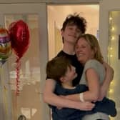 Nicola Sharpe was embraced by her boys Finley and Rory when she arrived back home (Photo: Royal Papworth Hospital / SWNS)