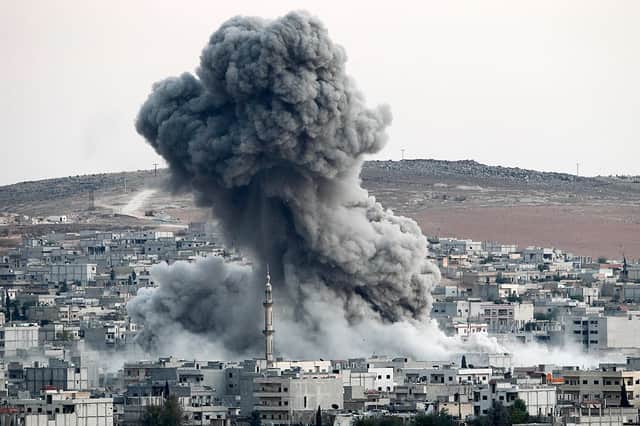 Heavy smoke rises following an airstrike by US-led coalition aircraft in Syria in 2014 (Photo: Gokhan Sahin/Getty Images)