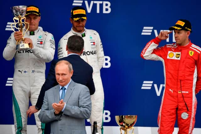 Vladimir Putin presented trophies at the Russian Grand Prix in 2017 - just three years after his troops annexed Crimea (image: AFP/Getty Images)